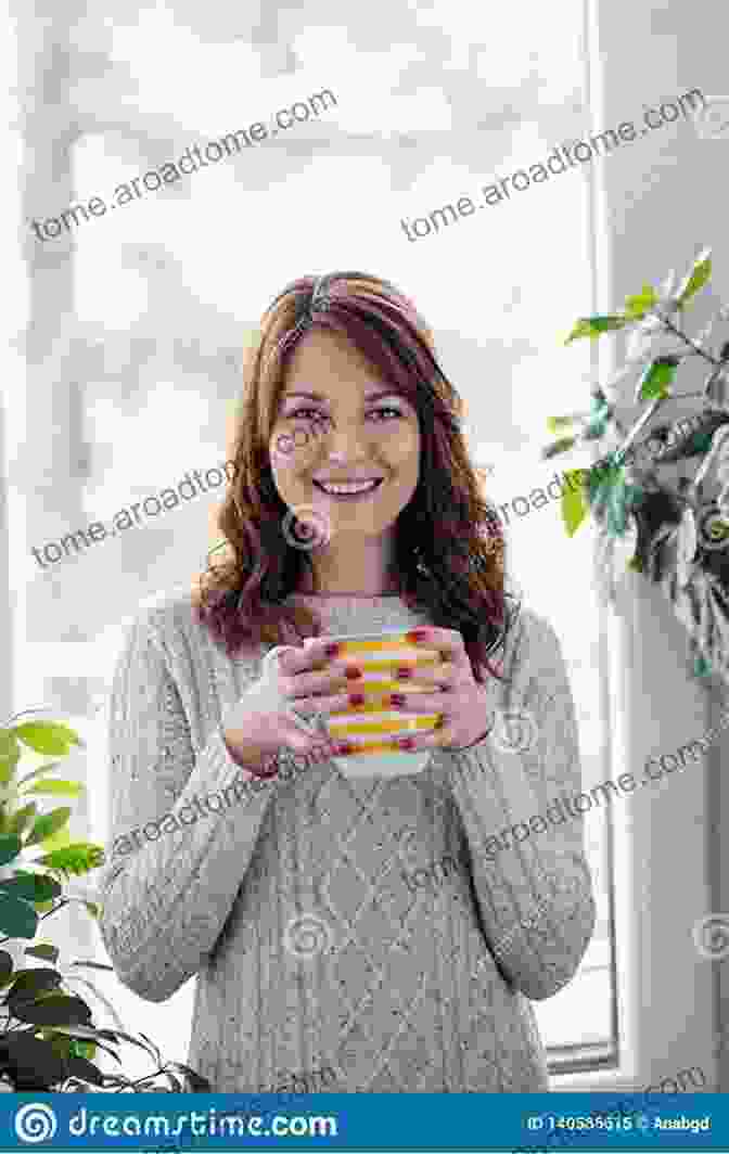 A Person Enjoying A Cup Of Tea By A Window, Surrounded By Cozy Textiles And Warm Lighting Hygge Home: Cozy Danish Ideas For House Interiors