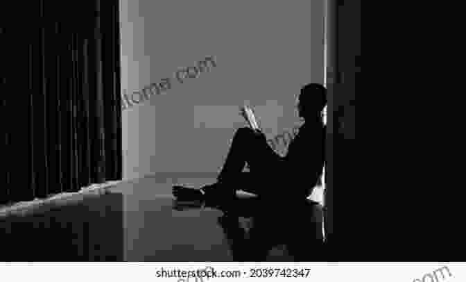 A Person Sitting In A Dark Room, Alone With Their Digital Device, Representing The Potential Risks Of Technology Addiction Becoming A Digital Parent: A Practical Guide To Help Families Navigate Technology