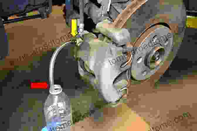 A Technician Bleeding The Brakes Of A Pontiac 8s How To Rebuild Pontiac V 8s Updated Edition (Cartech)