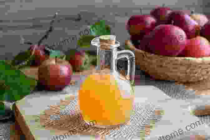 Apple Cider Vinegar Bottle Surrounded By Fresh Apples And Leaves Getting To The Core Of Apple Cider Vinegar:The Ultimate Guide To Apple Cider Vinegar Health Benefits Home Remedies And More